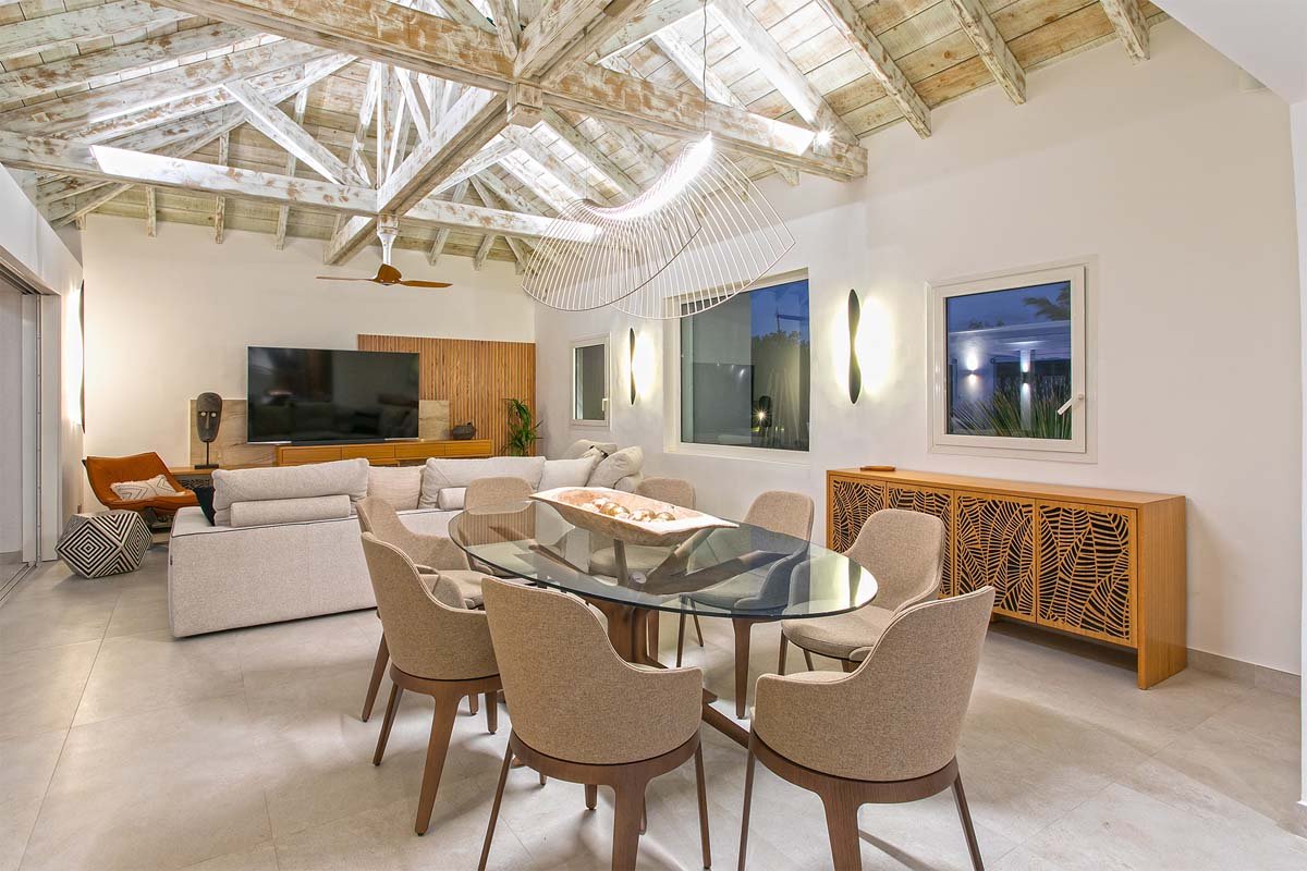 Spacious living room with ocean views, African-inspired decor, and 82” Smart TV at Villa Avanti, St. Martin.