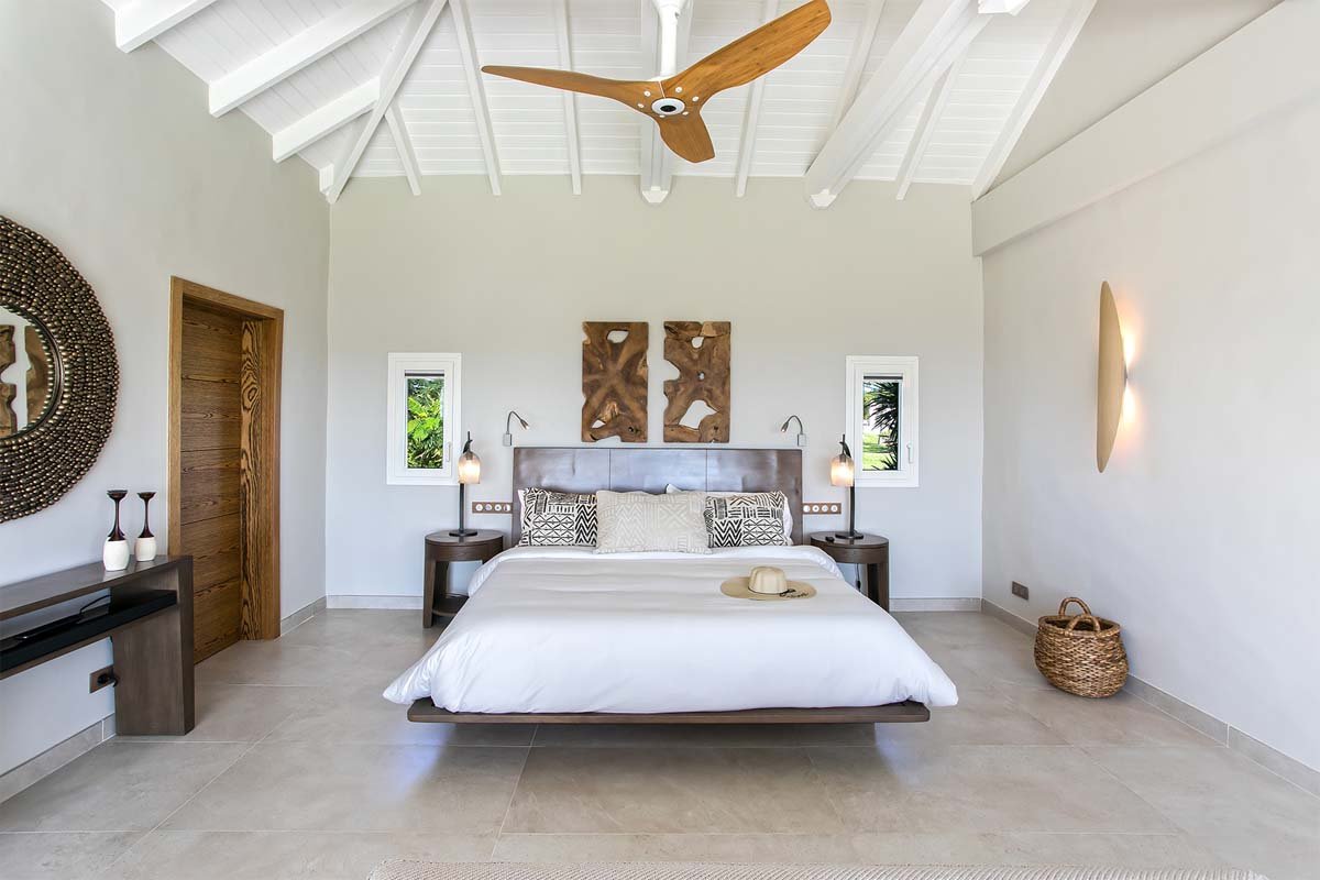 Master bedroom with king bed, terrace access, and ocean view, Villa Avanti, St. Martin.