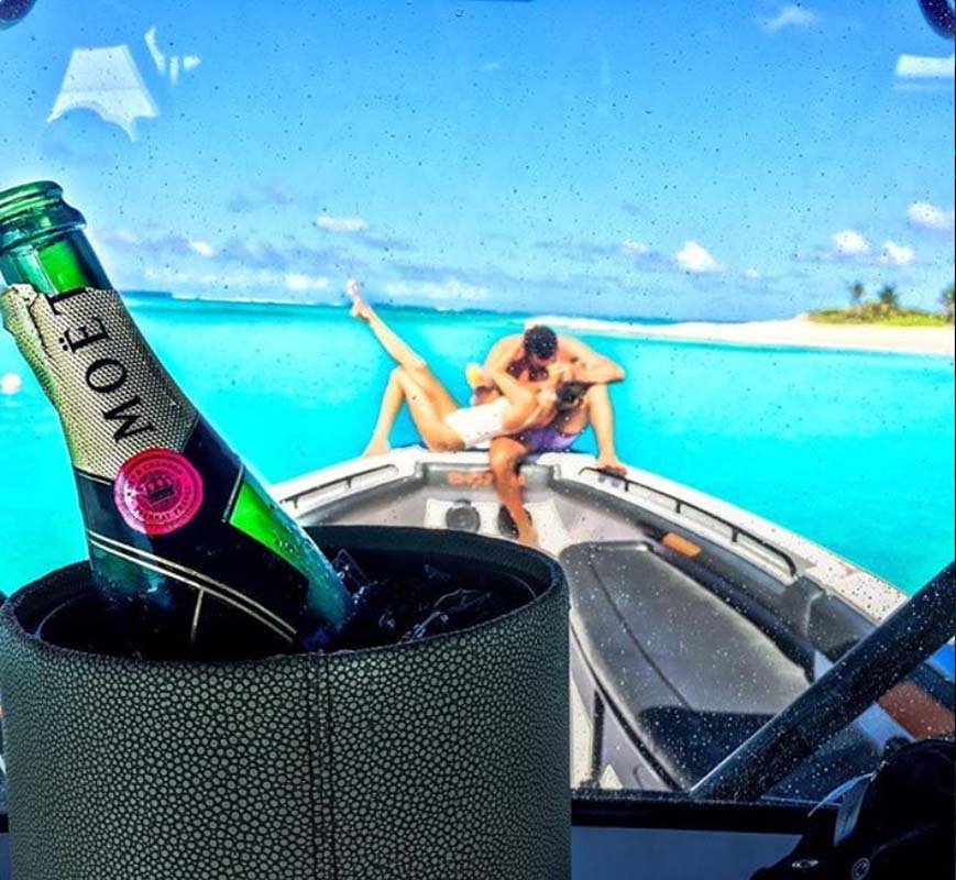 Couple enjoying a romantic sunset cruise aboard a luxury yacht in St. Martin