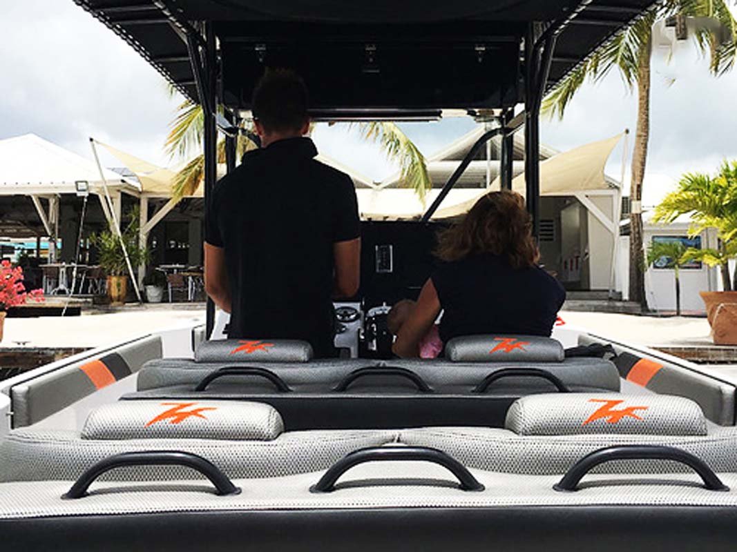 Captain navigating the Donzi ZF Impulse 38FT powerboat off St. Martin coast