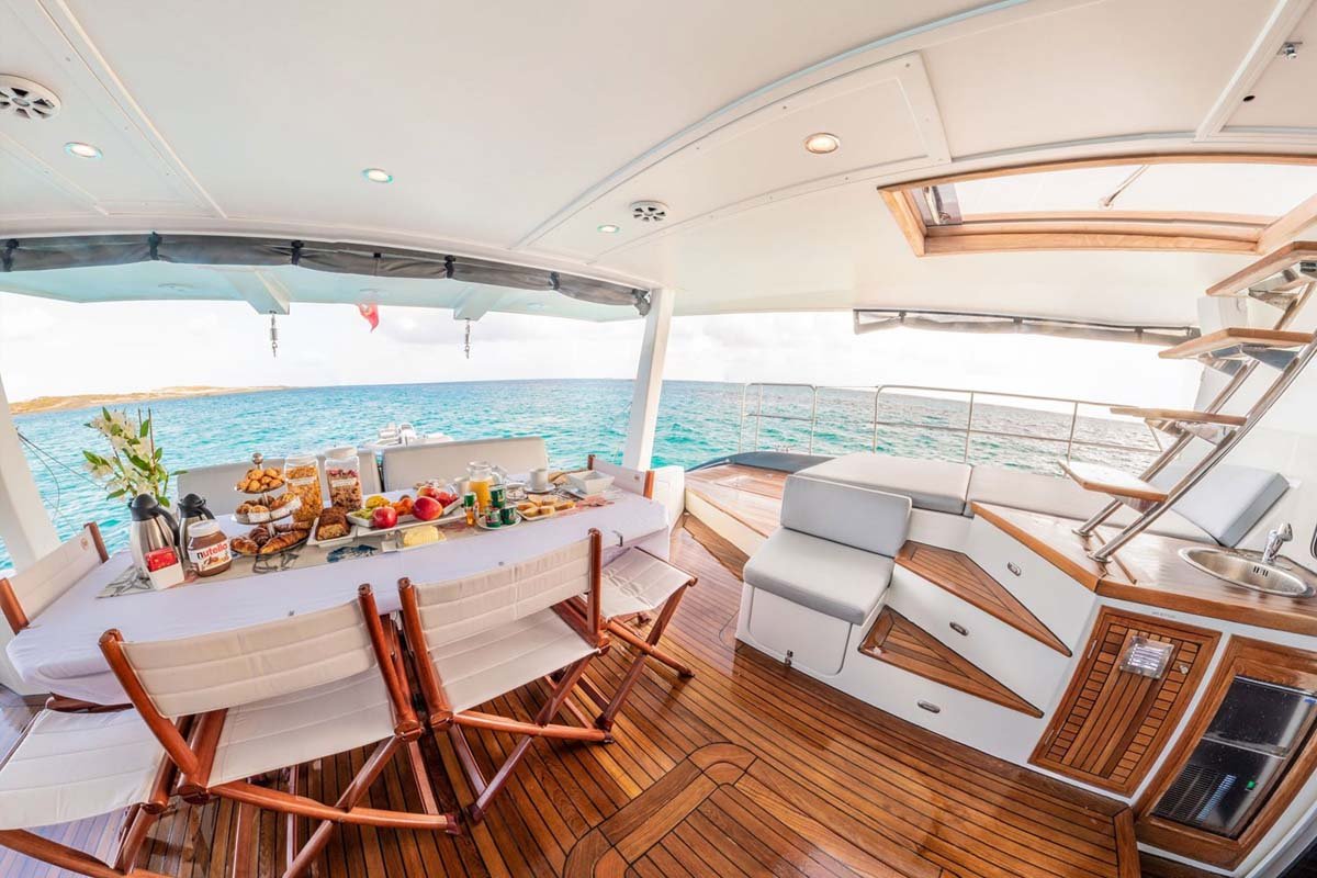 White Sunreef 62 sailing catamaran cruising tropical water, luxury yacht charter in St. Maarten