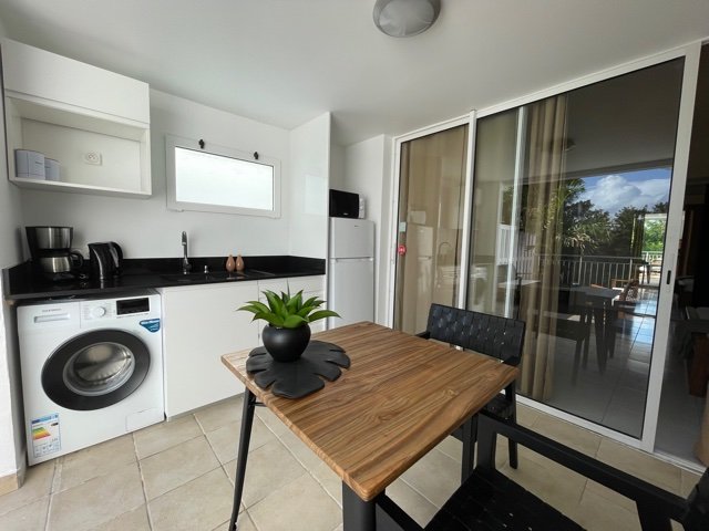 Washing Machine Studio at Paloma, a modern condo in Santa Ana, featuring a spacious layout and contemporary amenities