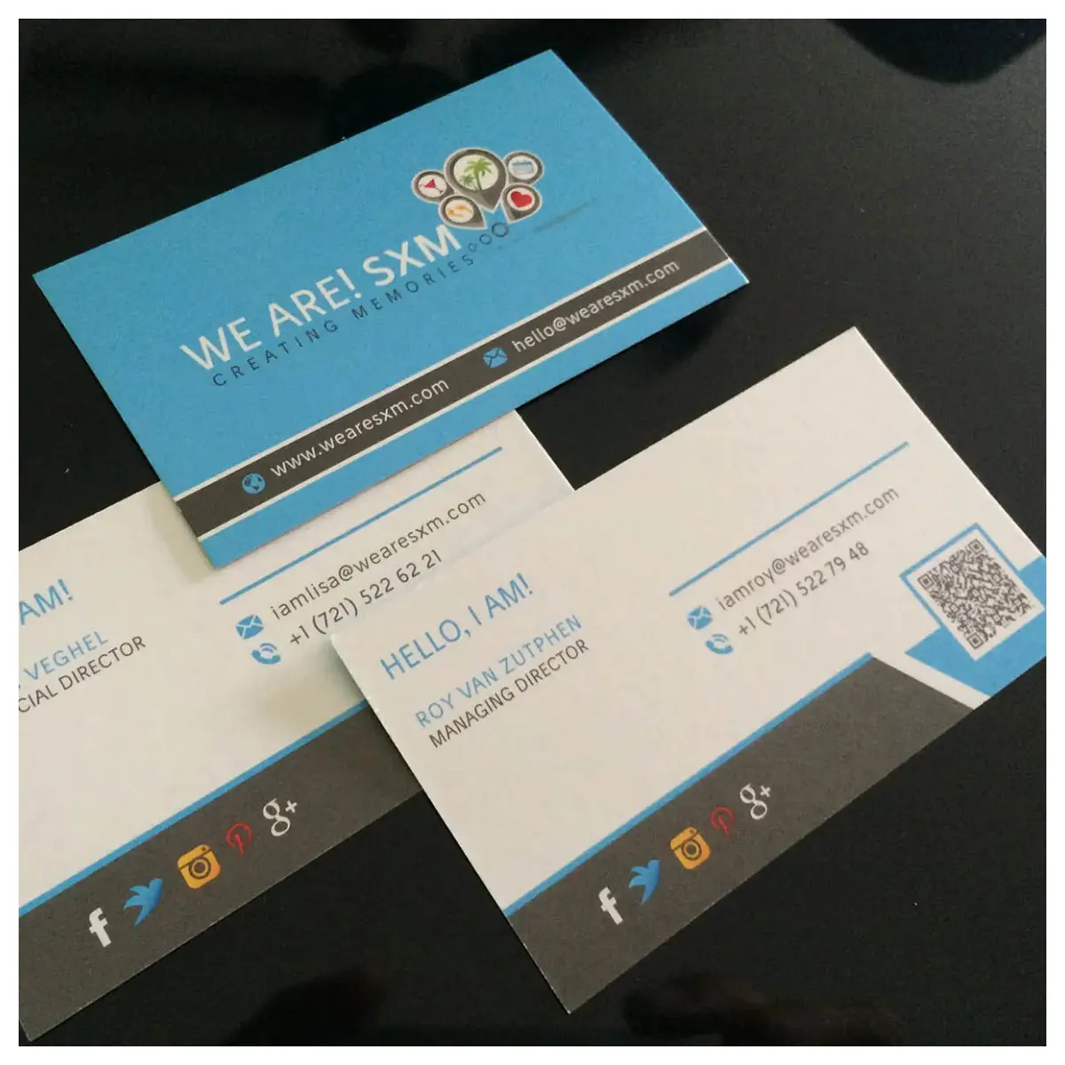 The first business cards of We Are! SXM, featuring a simple design with the brand's logo and contact information