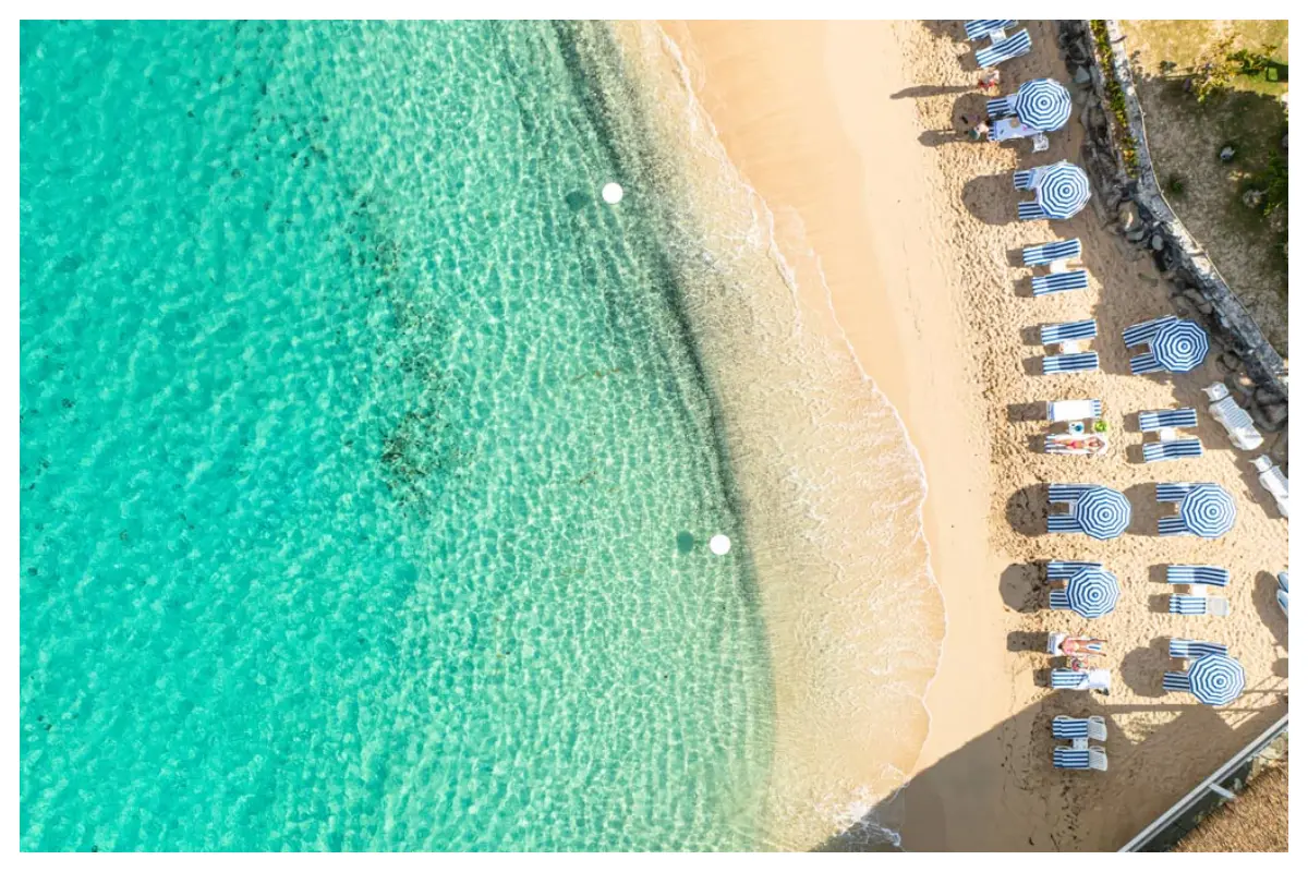 Beach chairs and water tables on Little Bay Beach at Grand Case Beach Club, St. Martin.