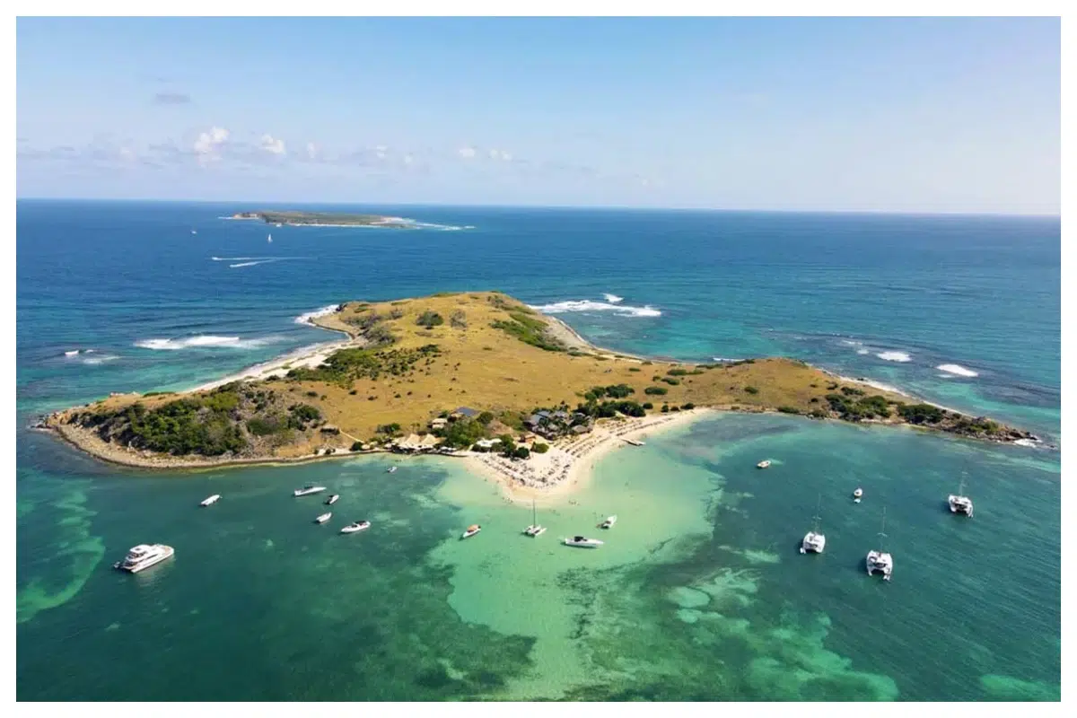 Pinel island, turquoise water, white sand, stunning view, carribean sea Pinel Island, Saint Martin—pristine white sand beaches and turquoise Caribbean waters