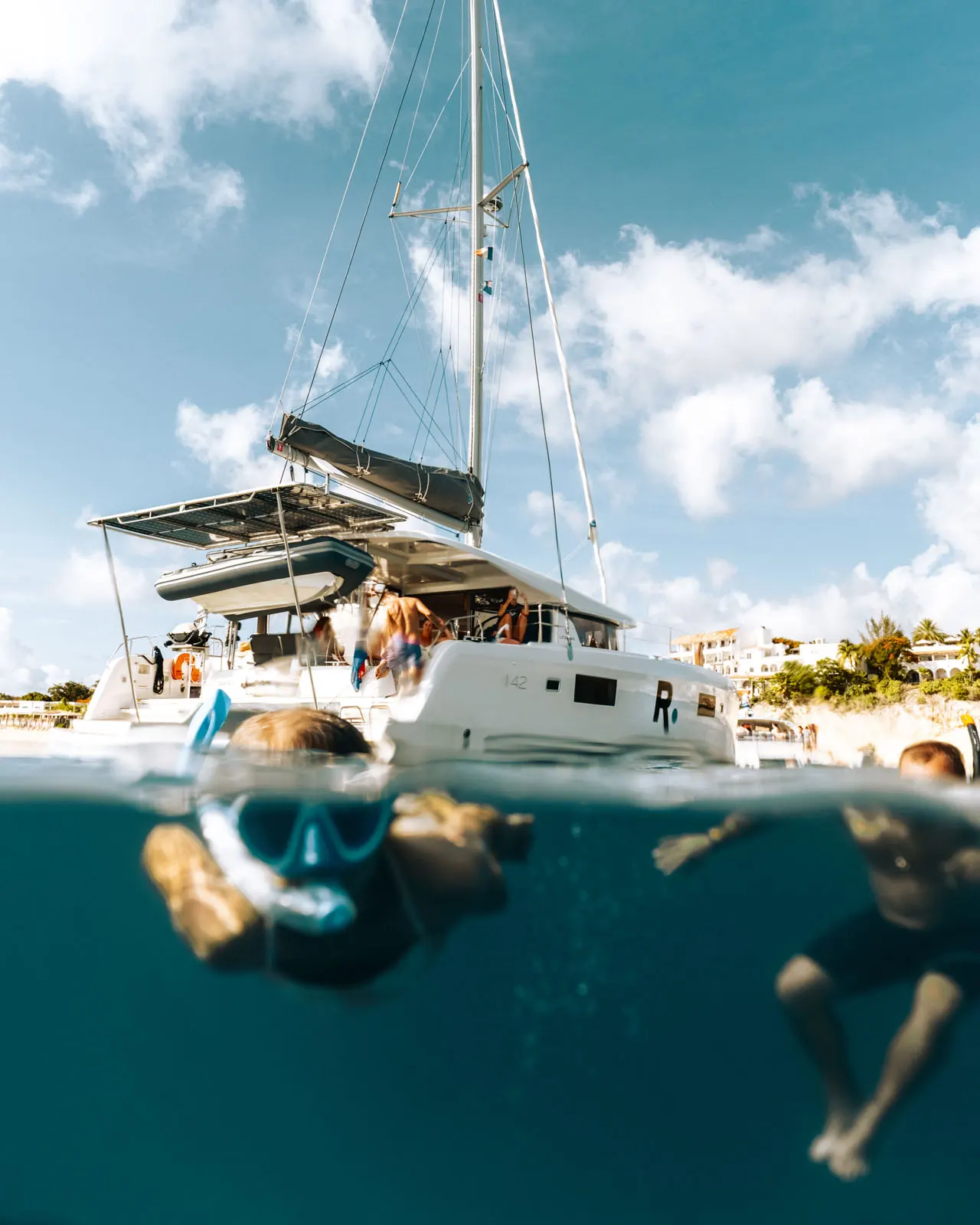 Luxury Renegades catamaran sailing over turquoise St. Maarten waters